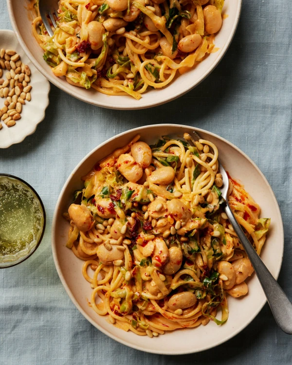 A Quick and Zesty Spring Pasta: Spaghetti with Greens, Butter Beans, and Harissa