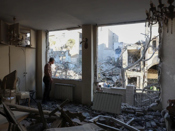 Amid Tehran's Aerial Assault, One Woman and Her Feline Companion Defy Despair