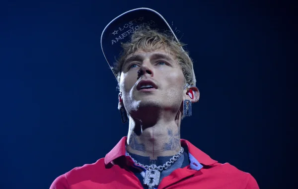 MGK Risks Injury with Daring Backflip Off Roof into Crowd