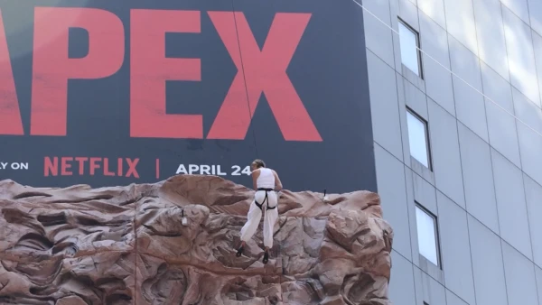 Charlize Theron Scales Times Square Billboards for Thriller 'Apex' Promotion