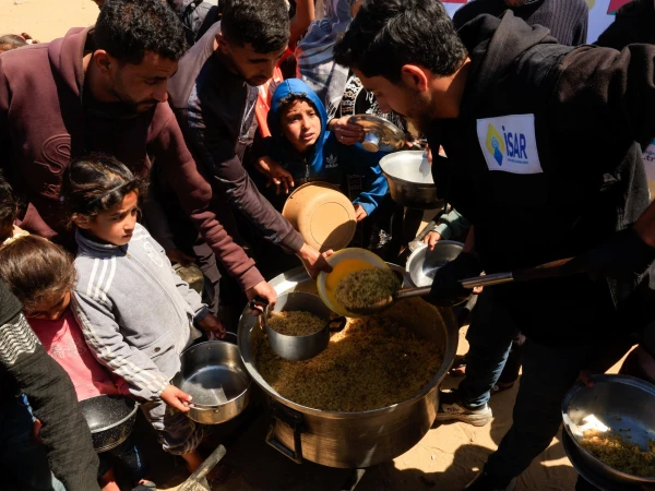 Israel's 'Starvation Strategy' Deepens Humanitarian Crisis in Gaza Amid Global Focus on Iran